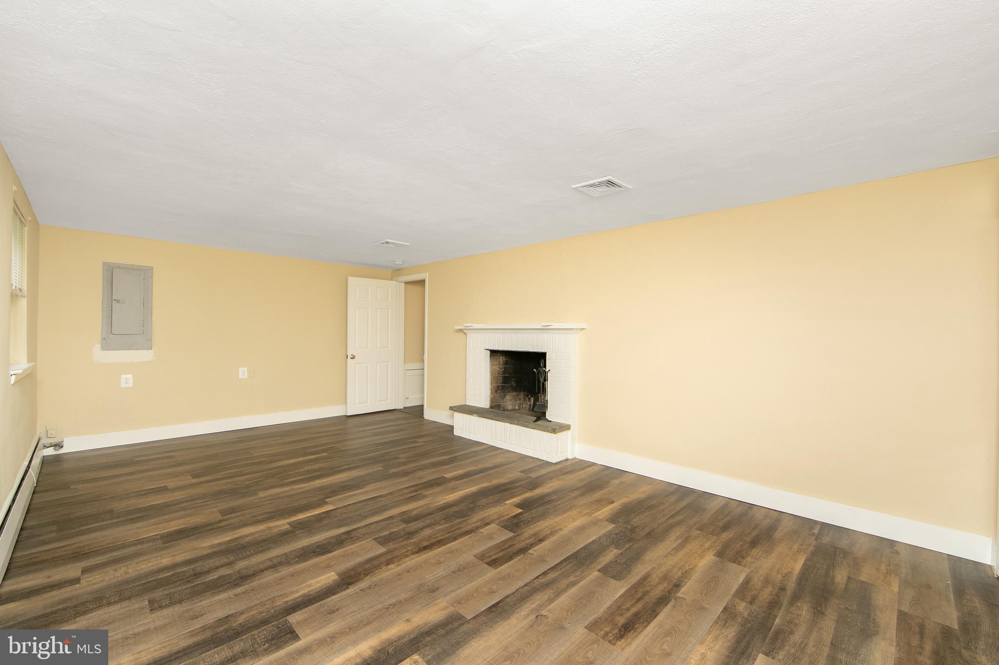 334 Parham Road Springfield, PA 19064 - Photo 25 of 41 a view of an empty room with wooden floor and a window
