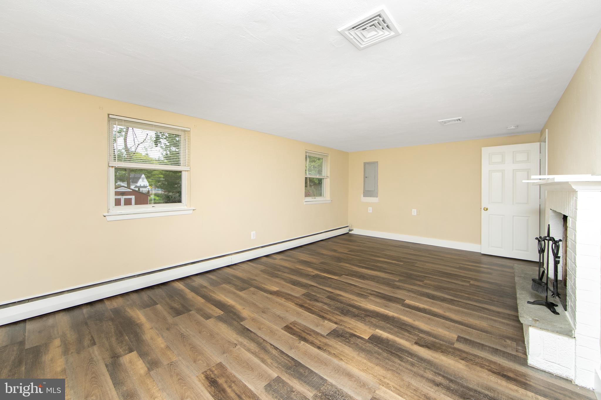 334 Parham Road Springfield, PA 19064 - Photo 26 of 41 a view of an empty room with wooden floor and a window