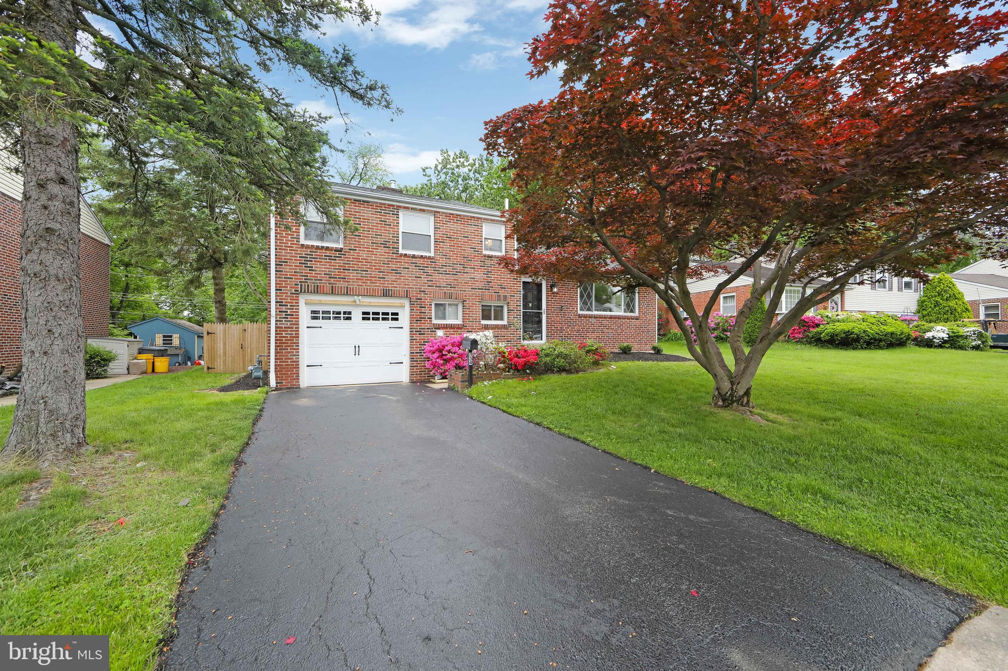 334 Parham Road Springfield, PA 19064 - Photo 3 of 41 a front view of house with yard and green space