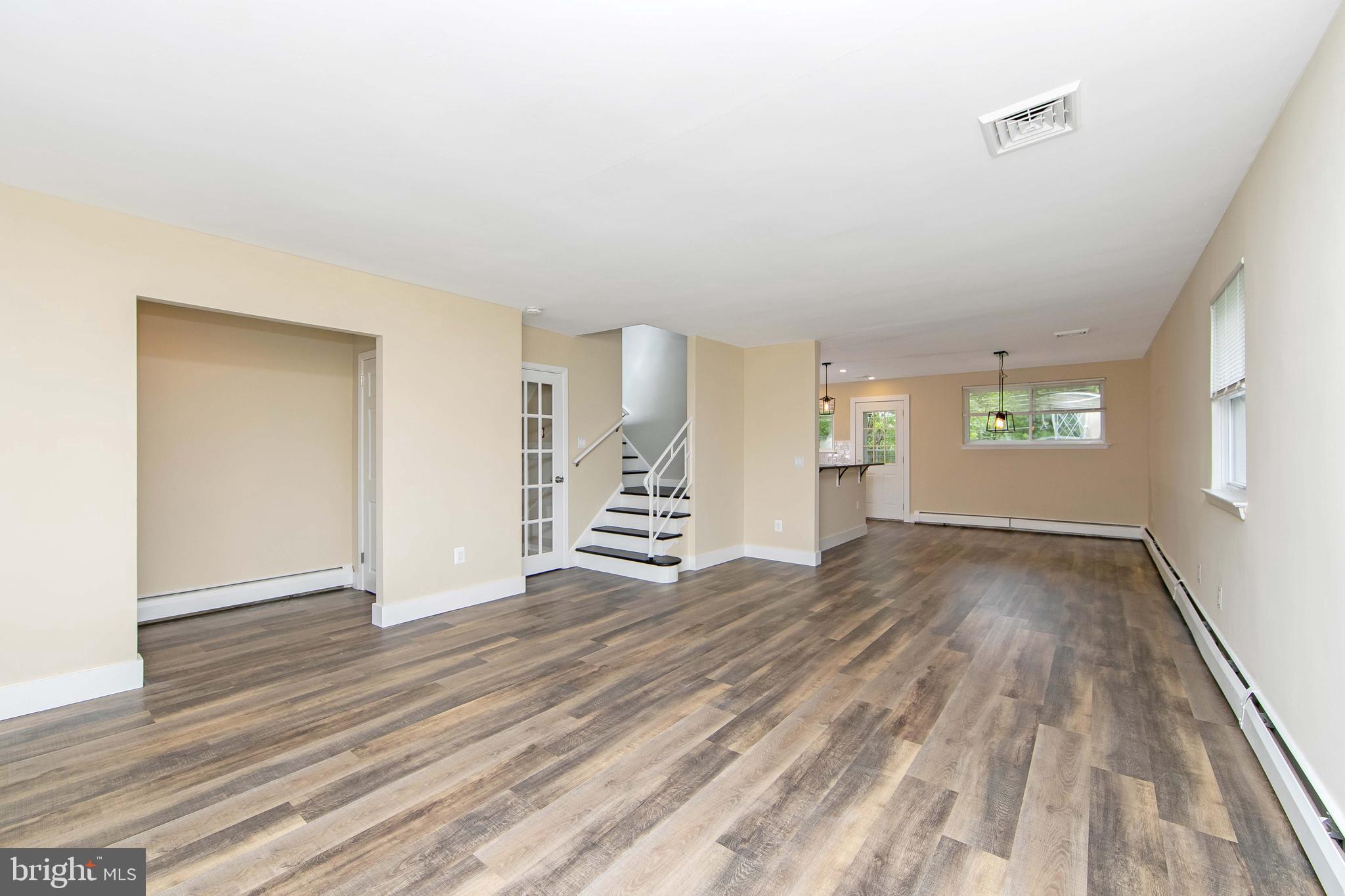 334 Parham Road Springfield, PA 19064 - Photo 8 of 41 a view of empty room with wooden floor and fan