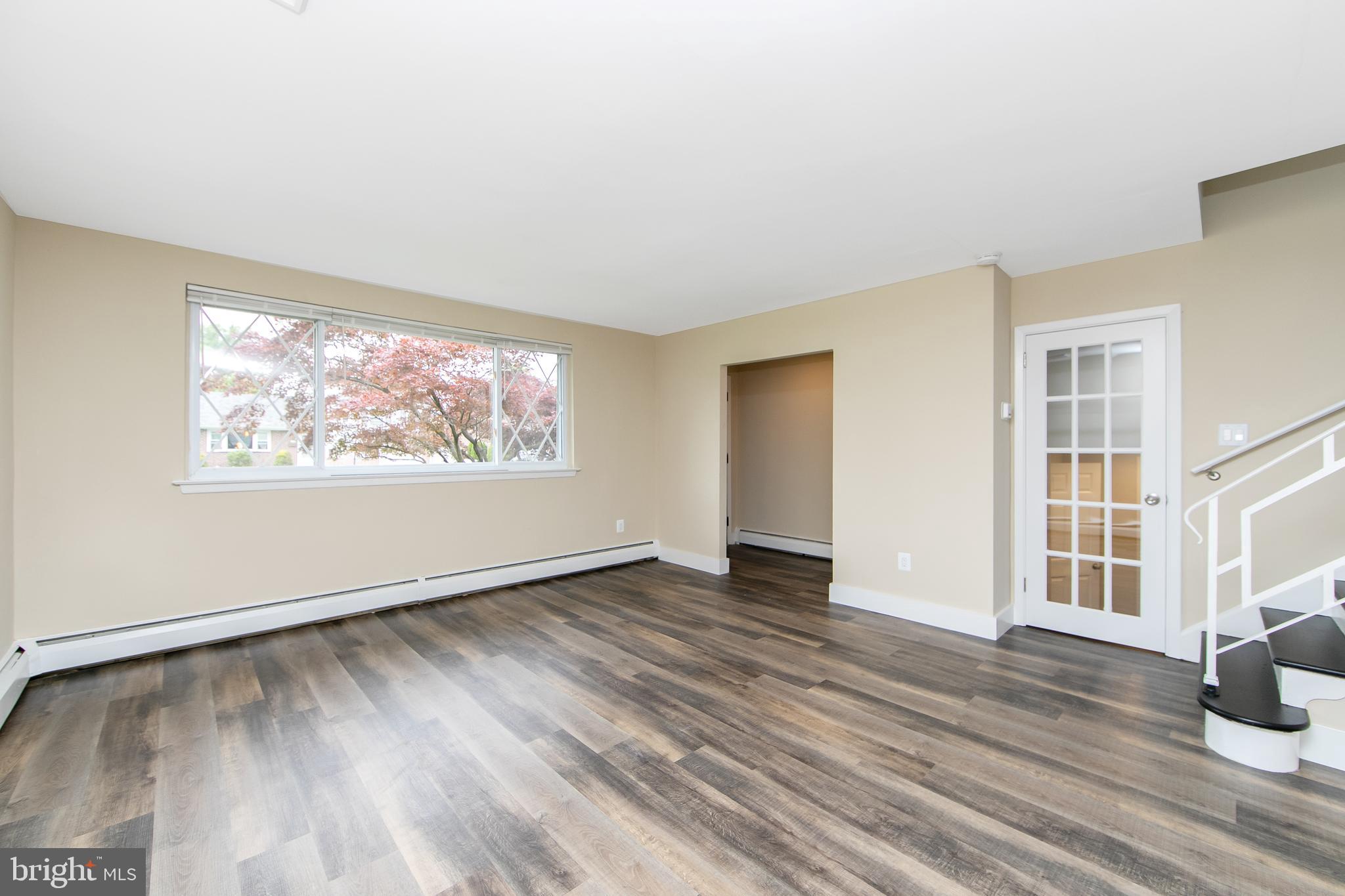 334 Parham Road Springfield, PA 19064 - Photo 10 of 41 a view of an empty room with wooden floor and a window