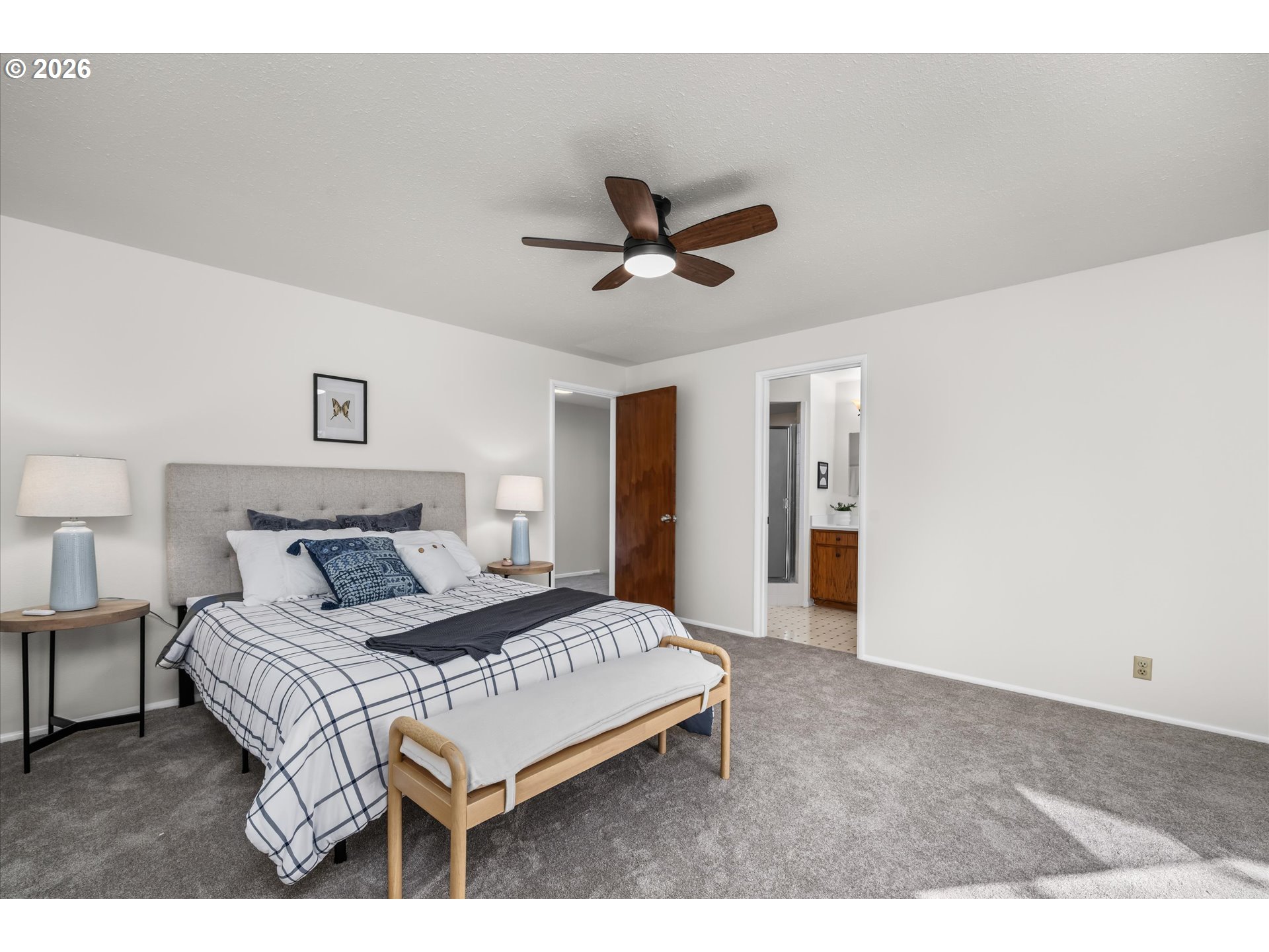 195 Coachman Drive Eugene, OR 97405 - Photo 15 of 34 a bedroom with a bed and a ceiling fan