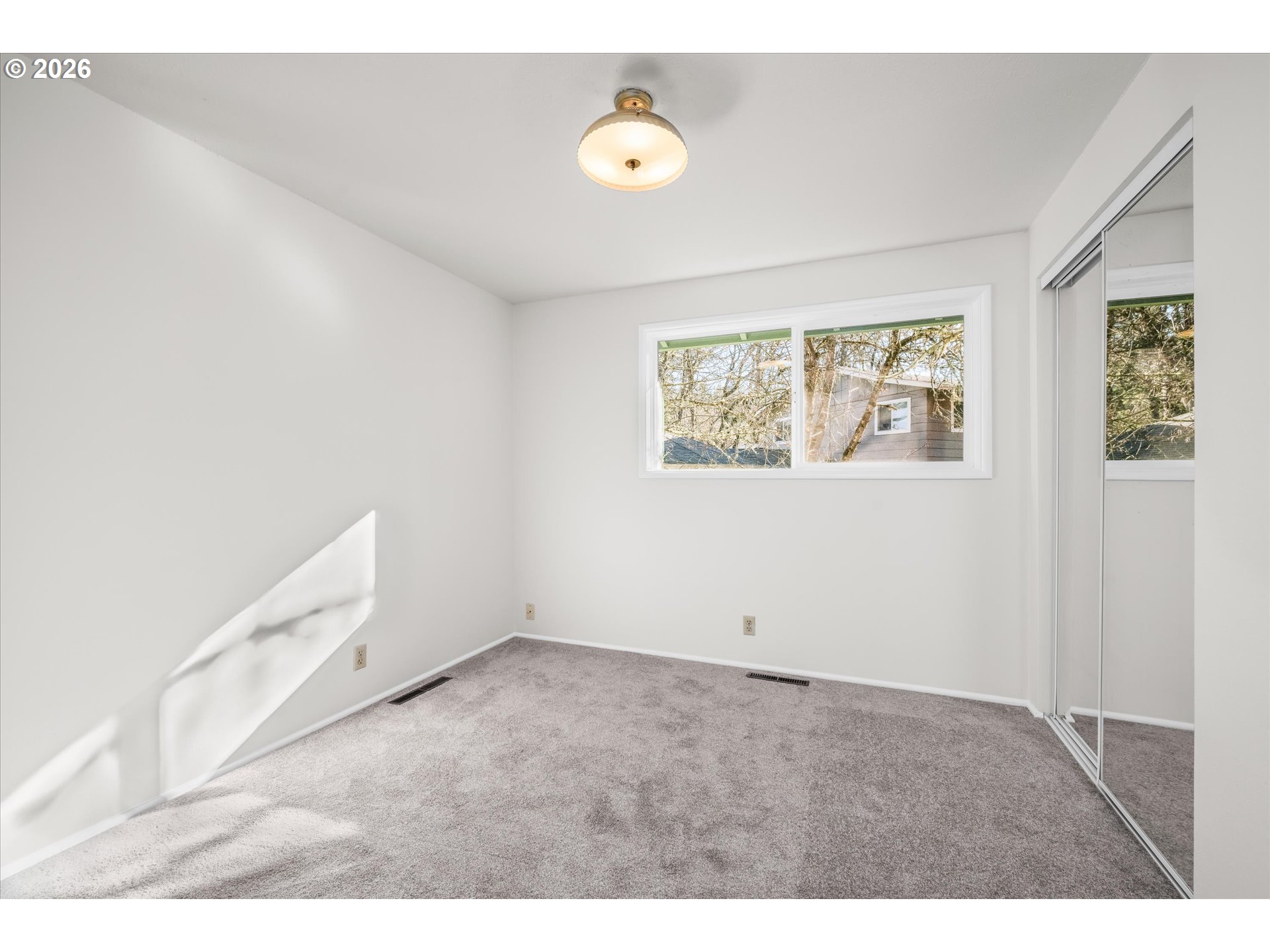 195 Coachman Drive Eugene, OR 97405 - Photo 20 of 34 a view of an empty room with a window