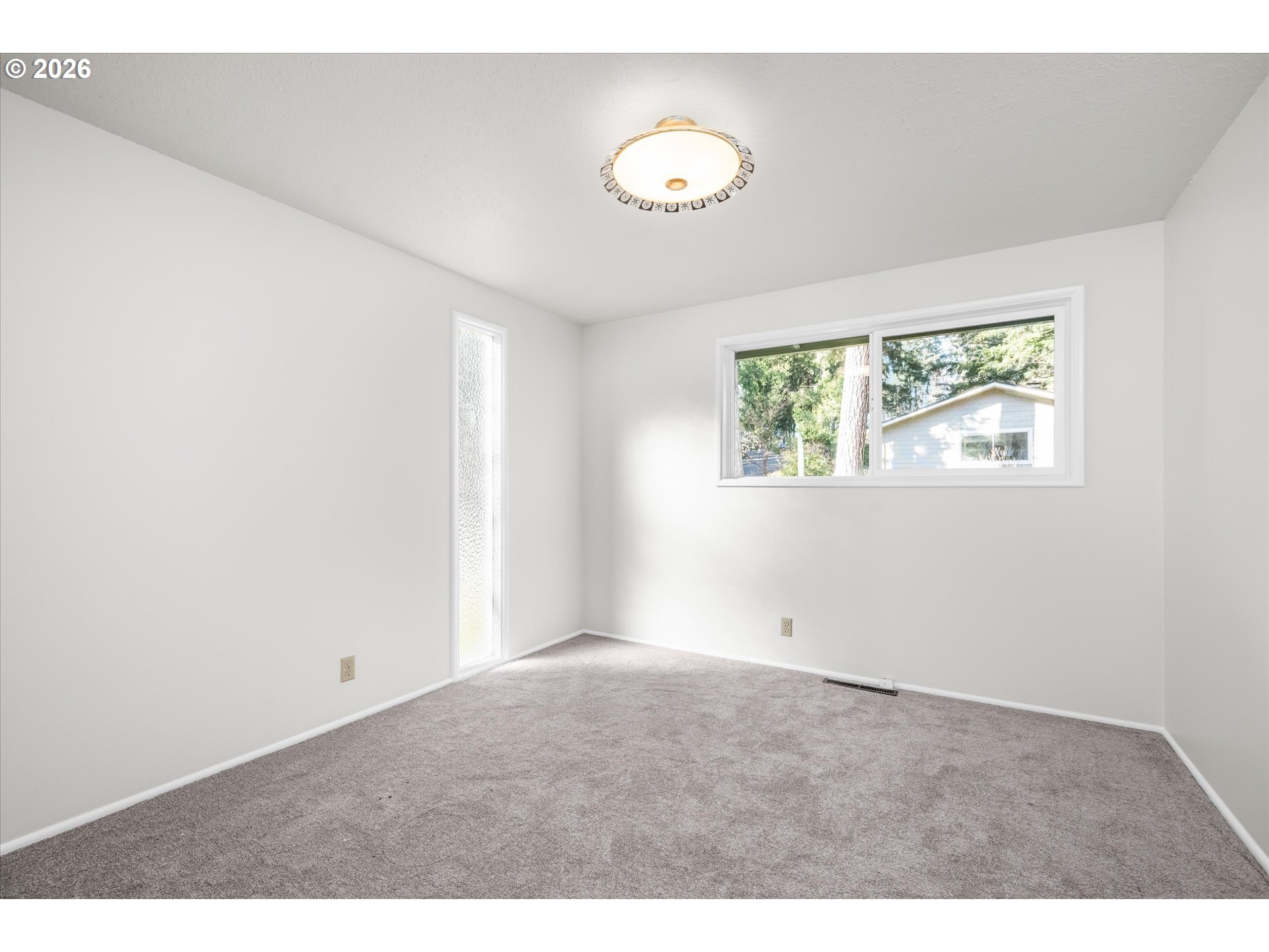 195 Coachman Drive Eugene, OR 97405 - Photo 24 of 34 a view of an empty room with a window