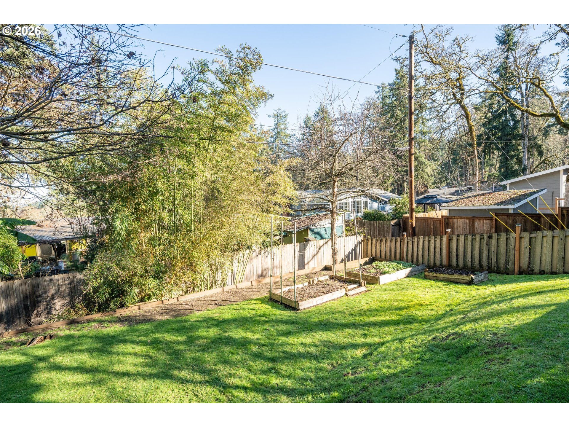 195 Coachman Drive Eugene, OR 97405 - Photo 32 of 34 a view of a backyard with a bench