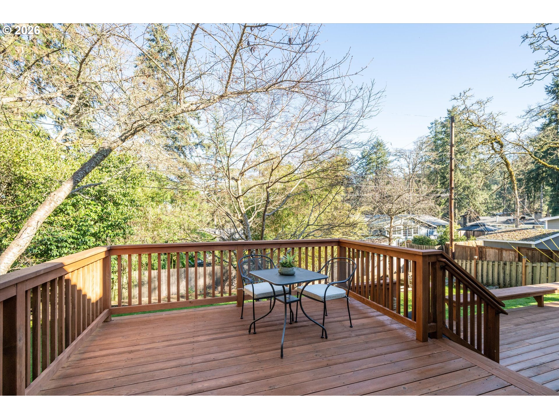195 Coachman Drive Eugene, OR 97405 - Photo 5 of 34 a view of balcony with wooden floor and outdoor seating