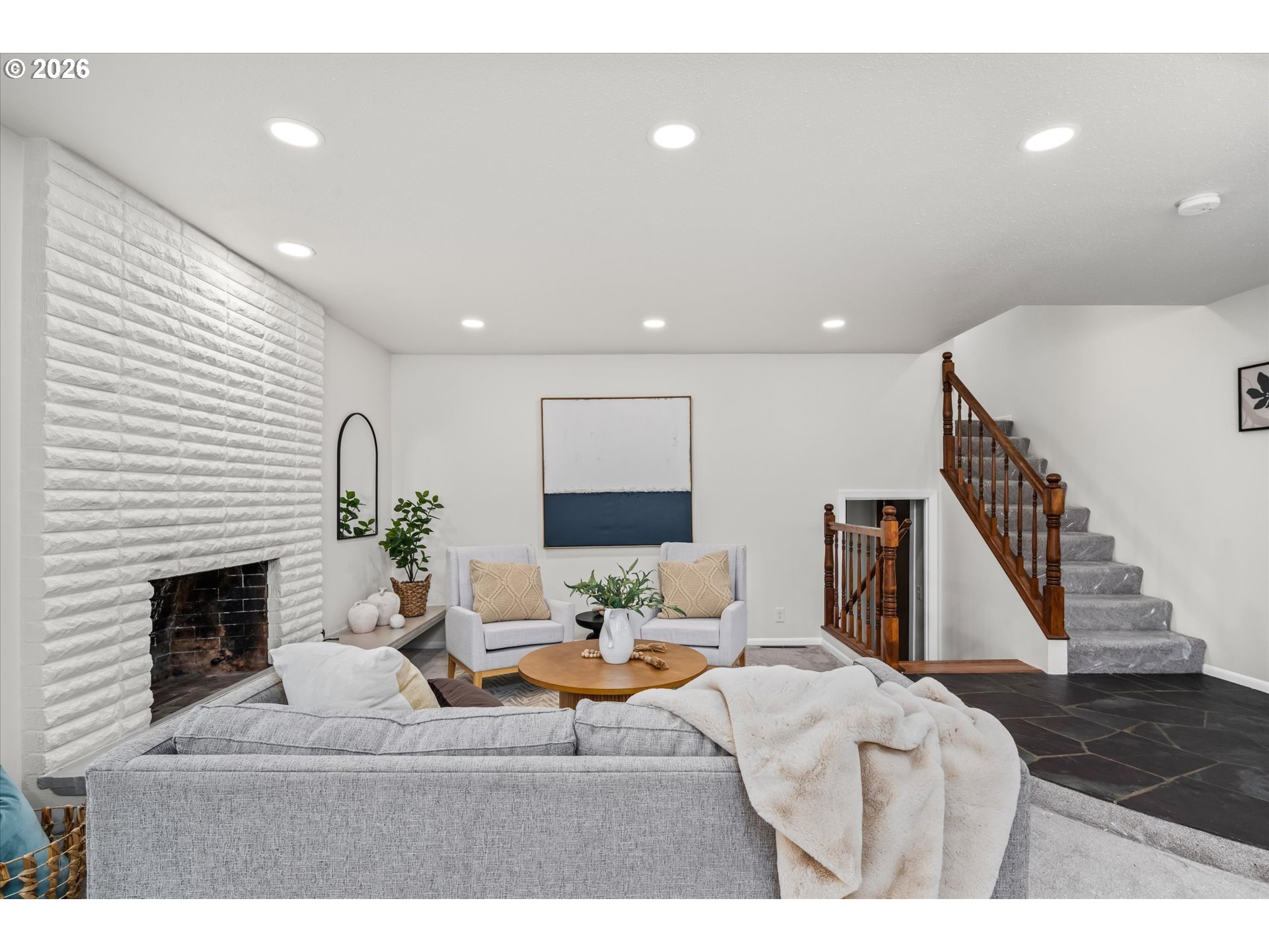 195 Coachman Drive Eugene, OR 97405 - Photo 6 of 34 a living room with furniture a fireplace and a flat screen tv