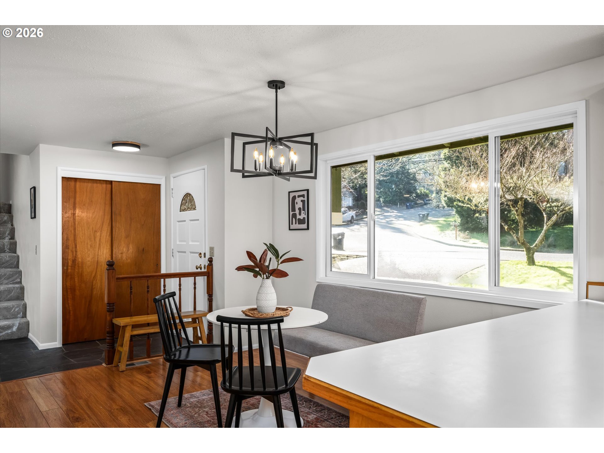 195 Coachman Drive Eugene, OR 97405 - Photo 8 of 34 a view of a dining room with furniture window and wooden floor