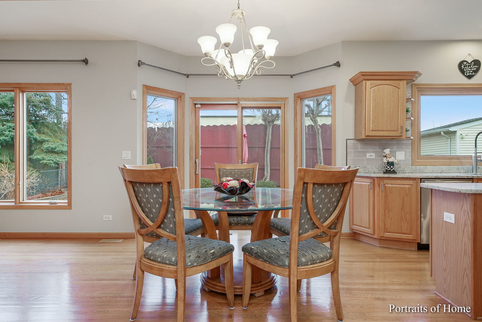 655 Mary Court Elmhurst, IL 60126 - Photo 12 of 46 a view of a dining room with furniture wooden floor and chandelier