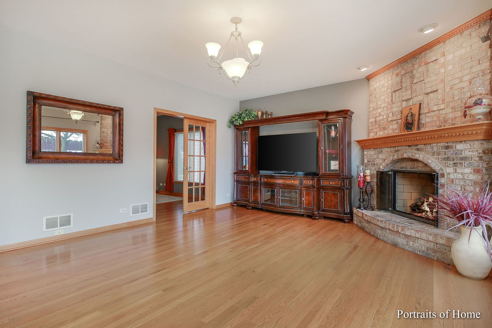 655 Mary Court Elmhurst, IL 60126 - Photo 15 of 46 a living room with furniture and a flat screen tv