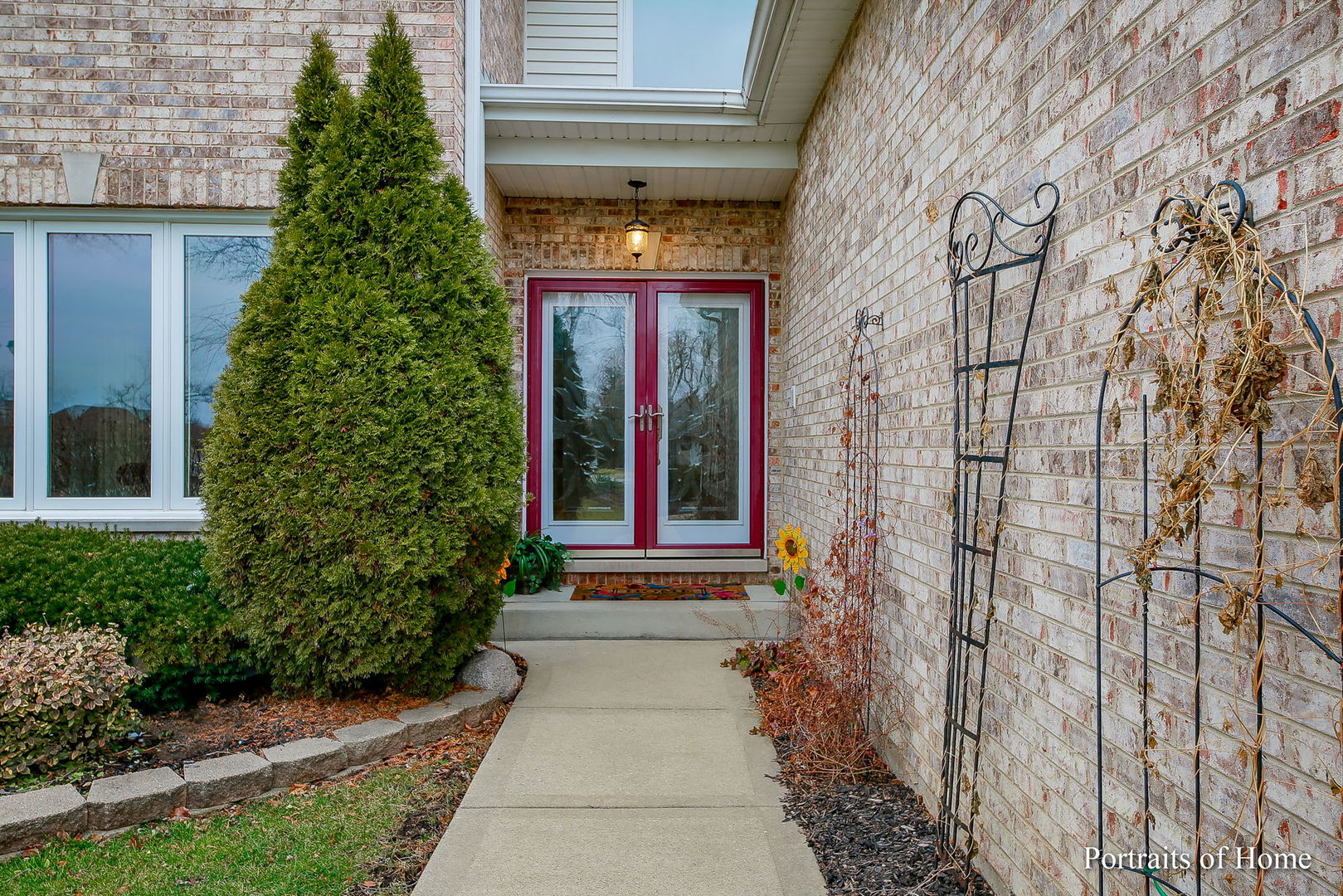 655 Mary Court Elmhurst, IL 60126 - Photo 2 of 46 a view of a pathway door with flower plants