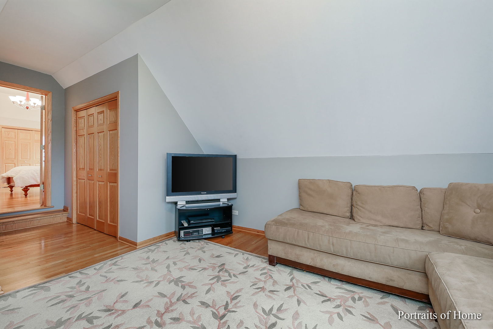655 Mary Court Elmhurst, IL 60126 - Photo 24 of 46 a living room with a couch and a flat screen tv