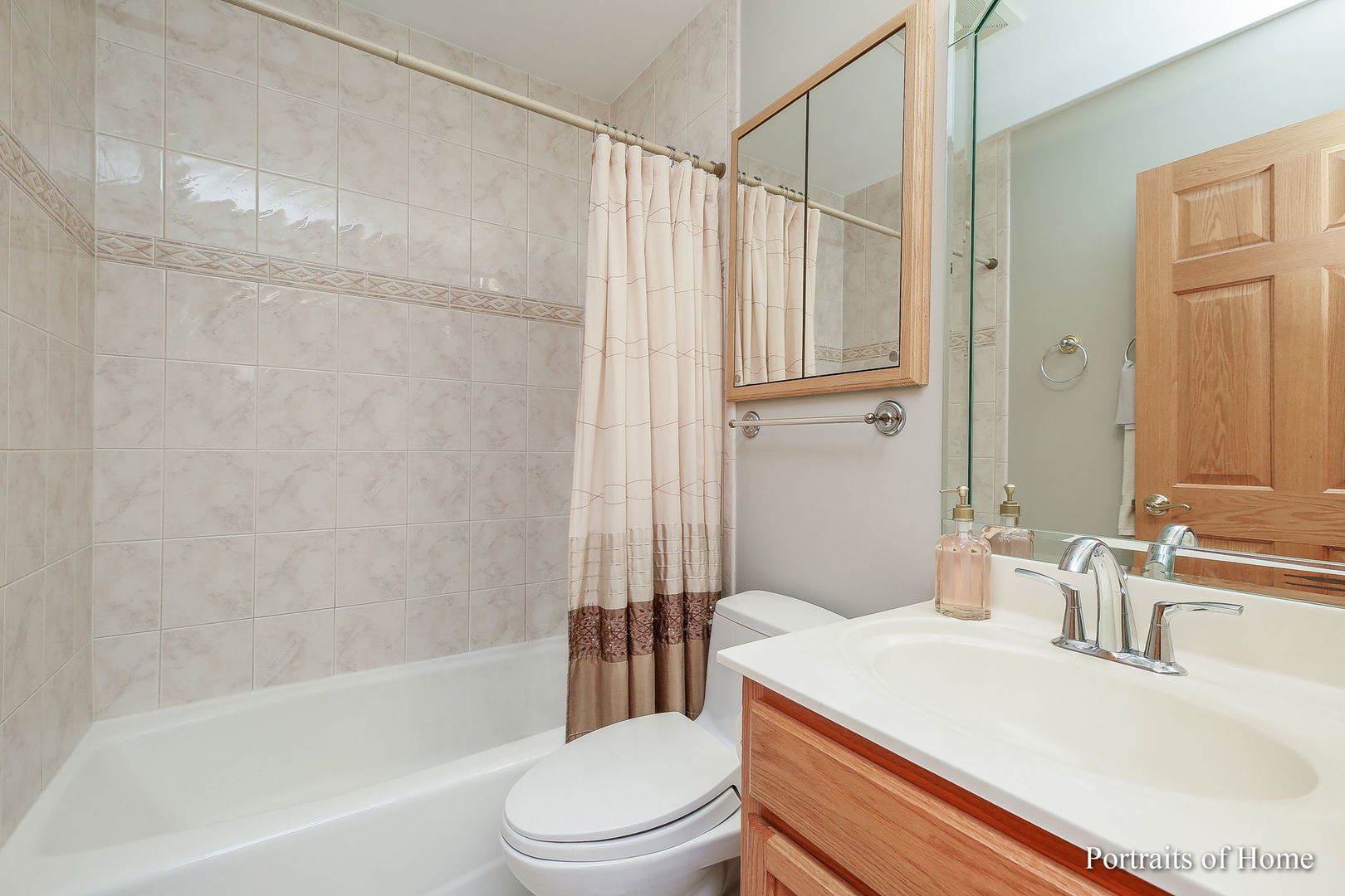 655 Mary Court Elmhurst, IL 60126 - Photo 30 of 46 a bathroom with a sink a toilet a mirror and a shower