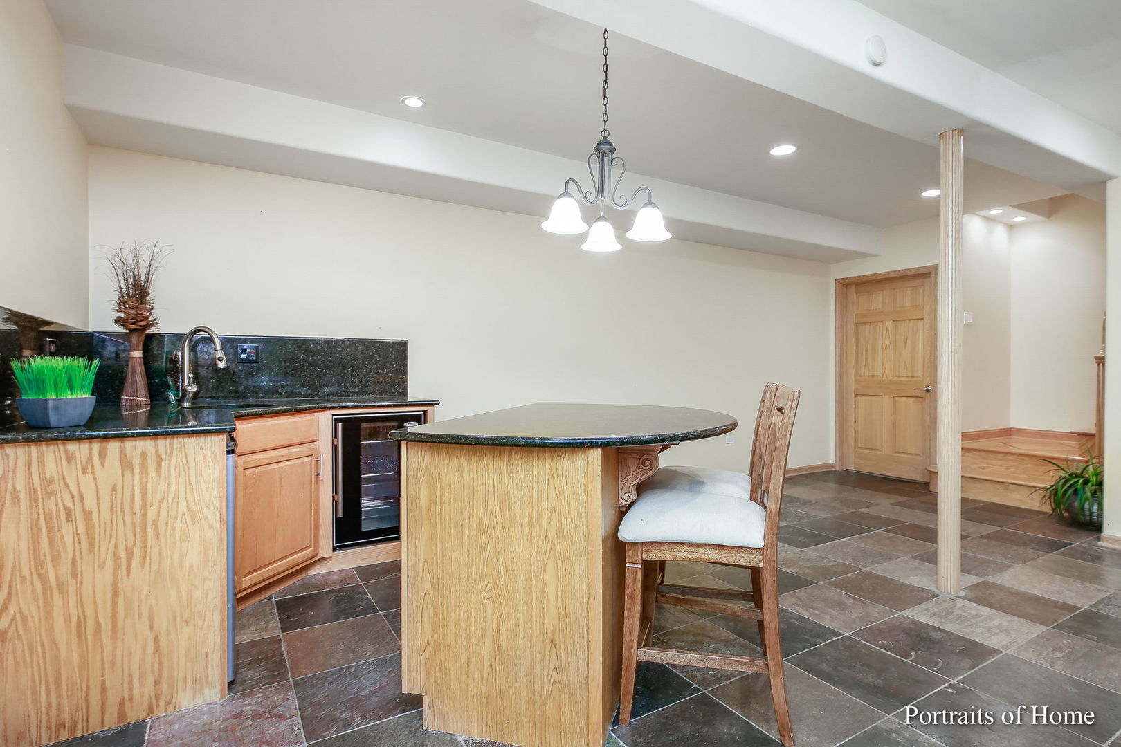 655 Mary Court Elmhurst, IL 60126 - Photo 32 of 46 a kitchen with stainless steel appliances granite countertop a stove and a refrigerator