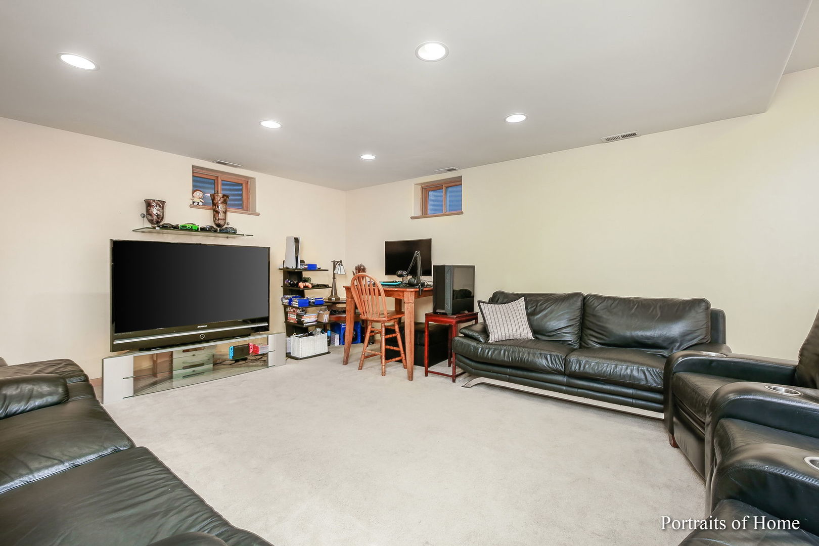 655 Mary Court Elmhurst, IL 60126 - Photo 33 of 46 a living room with furniture and a flat screen tv