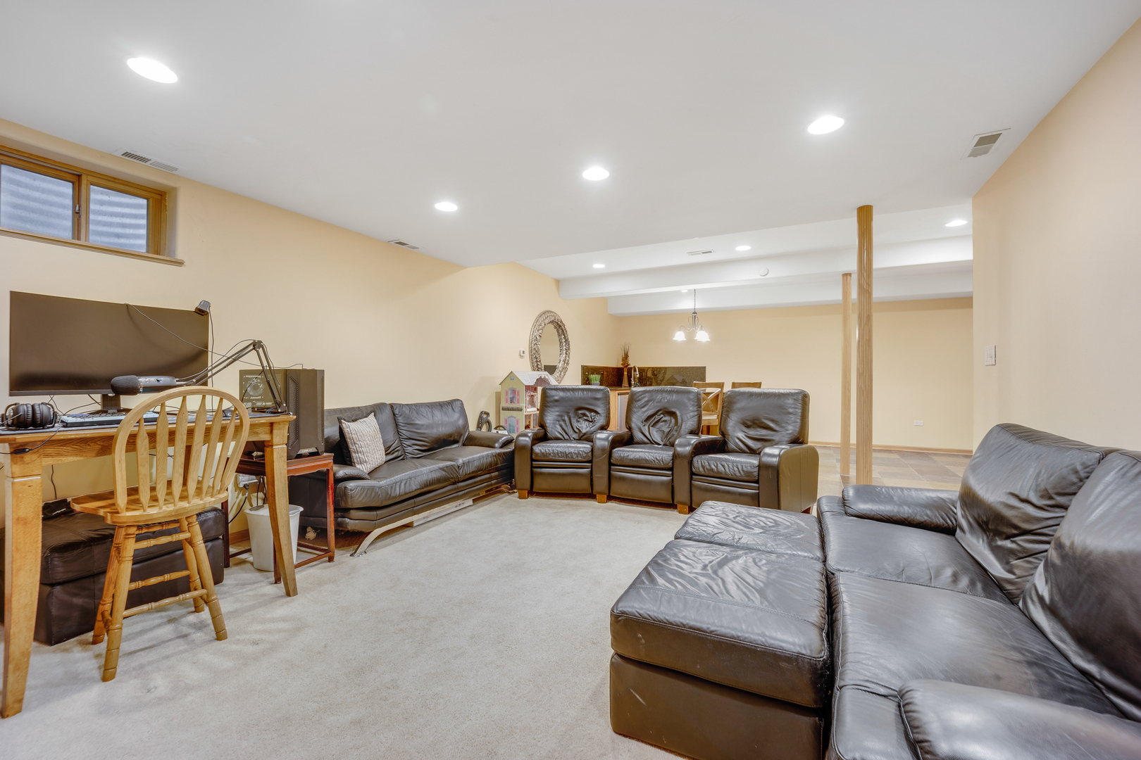 655 Mary Court Elmhurst, IL 60126 - Photo 34 of 46 a living room with furniture and a flat screen tv
