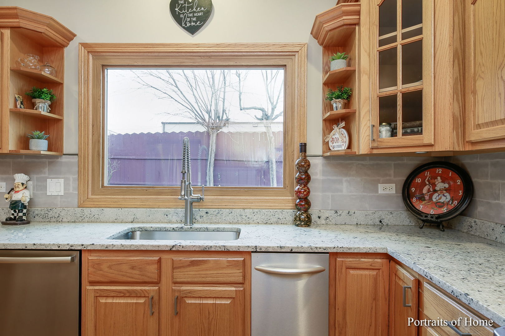 655 Mary Court Elmhurst, IL 60126 - Photo 9 of 46 a kitchen with stainless steel appliances granite countertop a sink and a stove