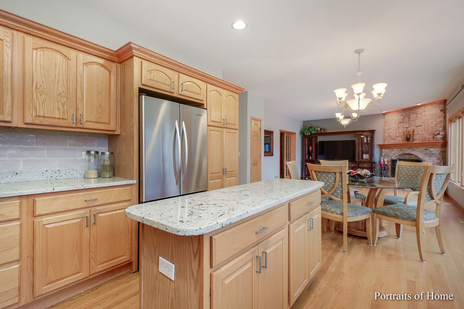 655 Mary Court Elmhurst, IL 60126 - Photo 10 of 46 a kitchen that has a lot of cabinets in it and stainless steel appliances