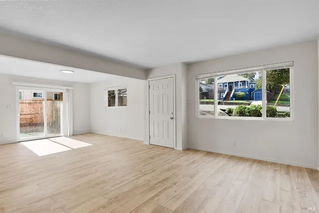 a view of an empty room with a window