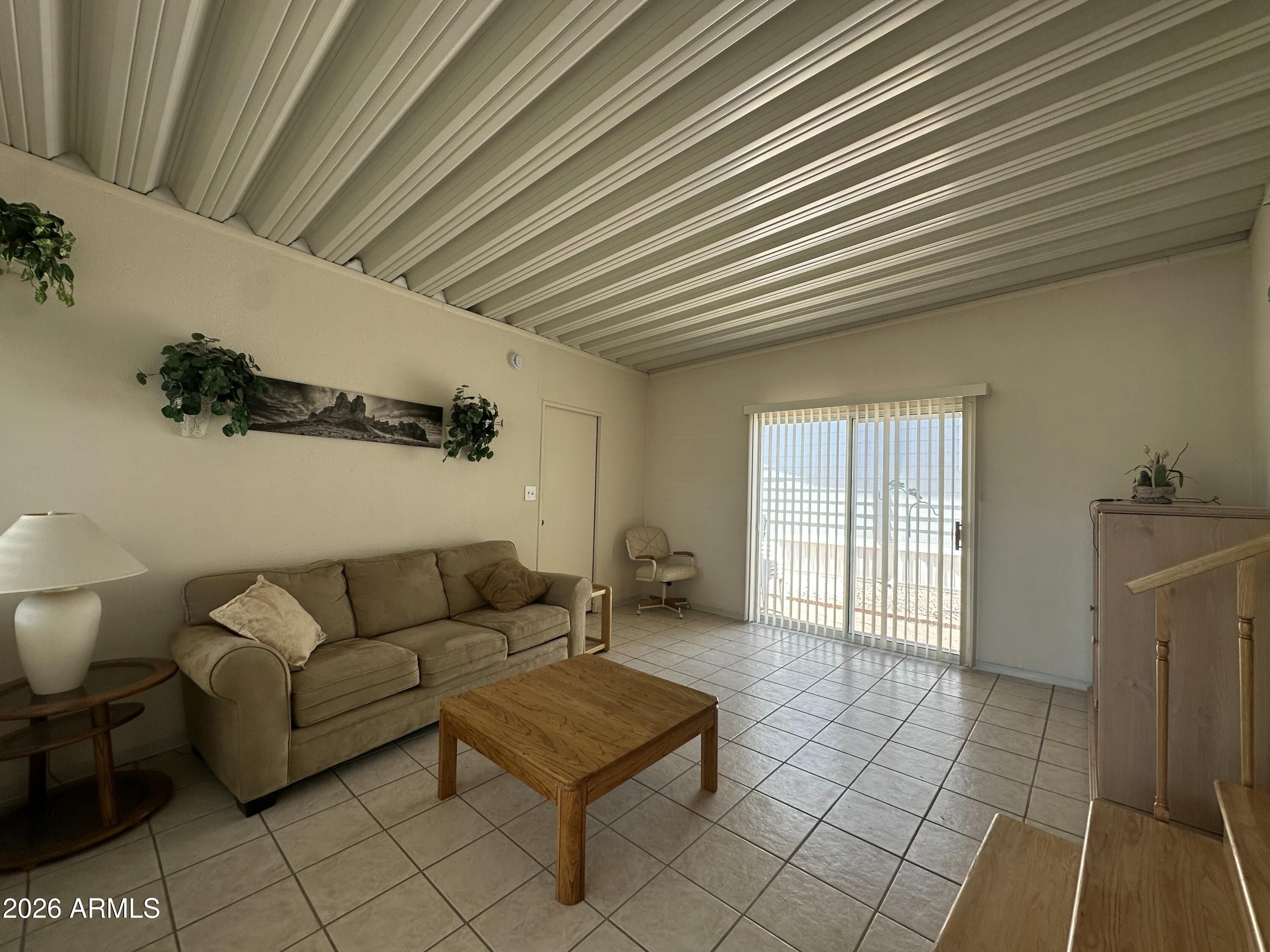 111 South Greenfield Road, Unit 575 Mesa, AZ 85206 - Photo 12 of 14 a living room with furniture