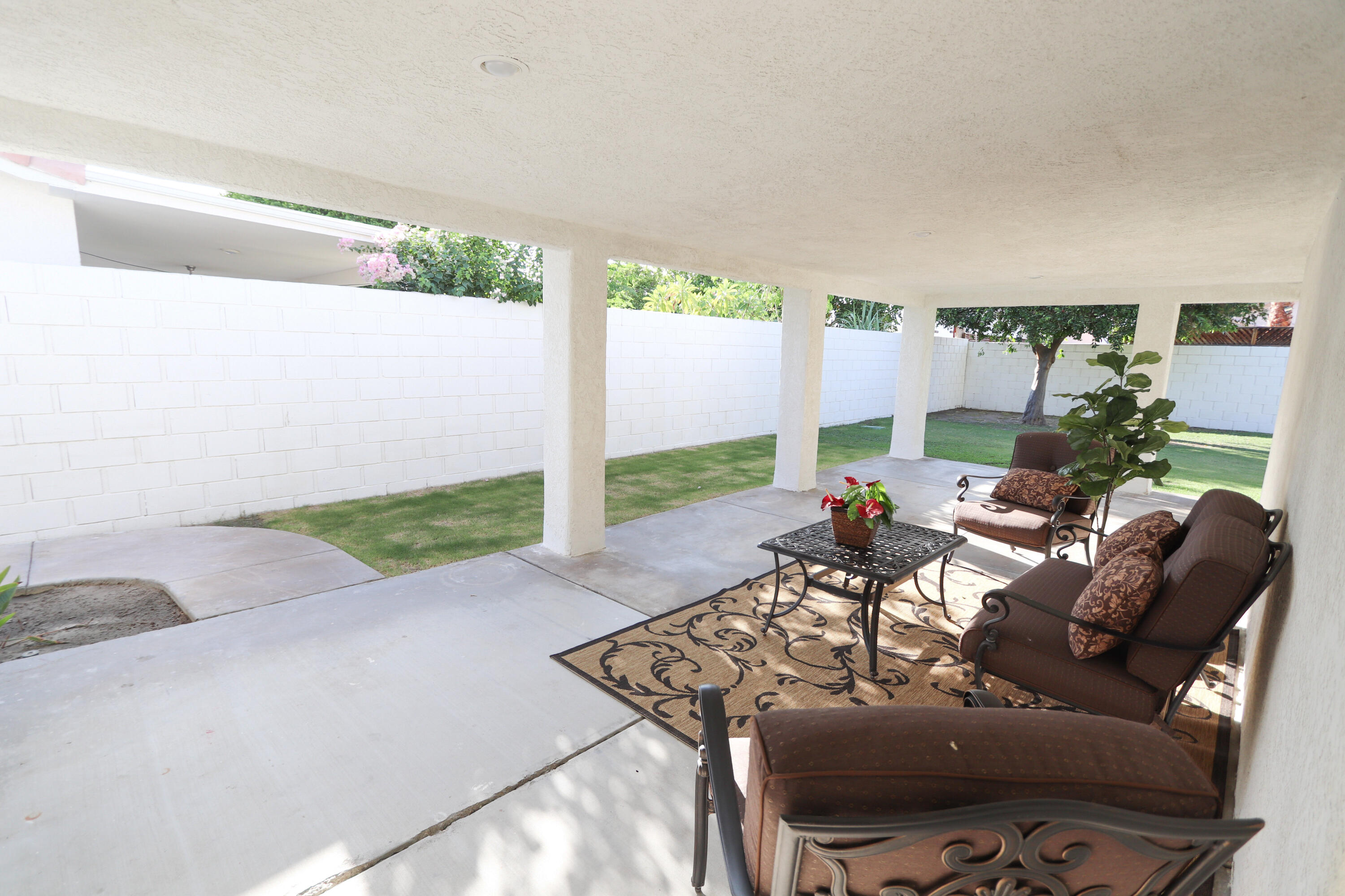 68250 Risueno Road Cathedral City, CA 92234 - Photo 18 of 19 a living room with furniture and a floor to ceiling window