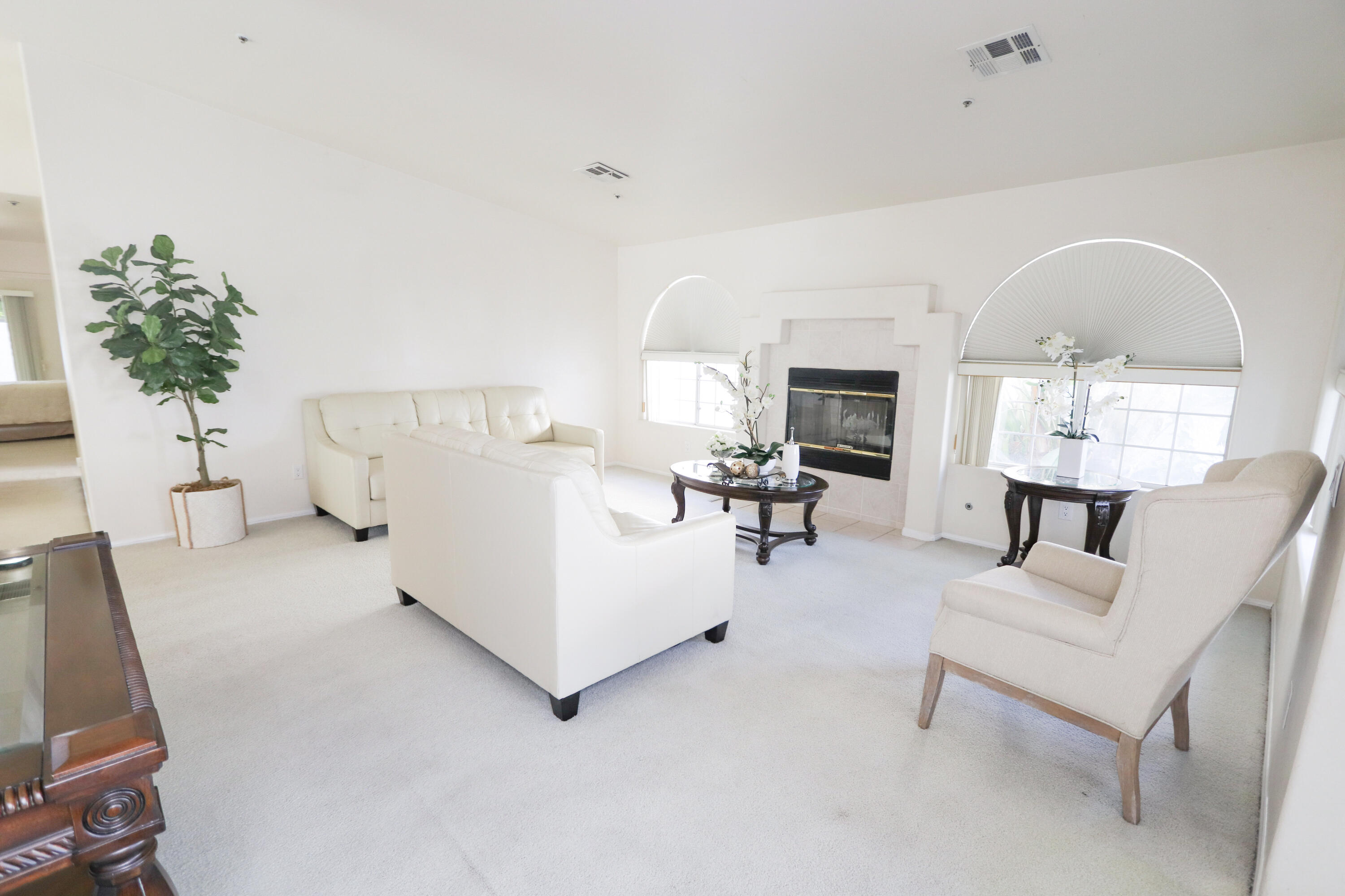 68250 Risueno Road Cathedral City, CA 92234 - Photo 3 of 19 a living room with furniture and a fireplace