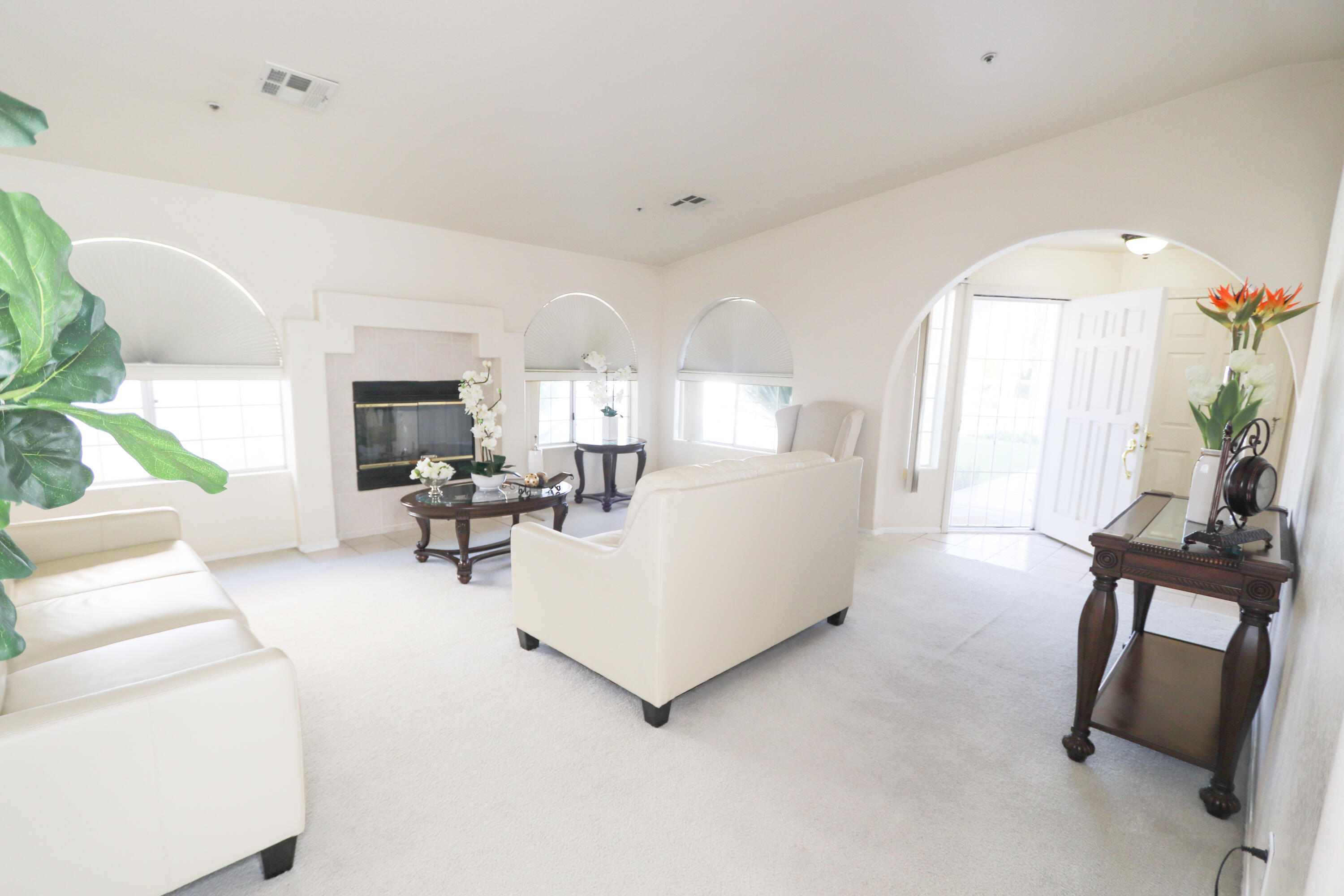 68250 Risueno Road Cathedral City, CA 92234 - Photo 5 of 19 a living room with furniture and a large window