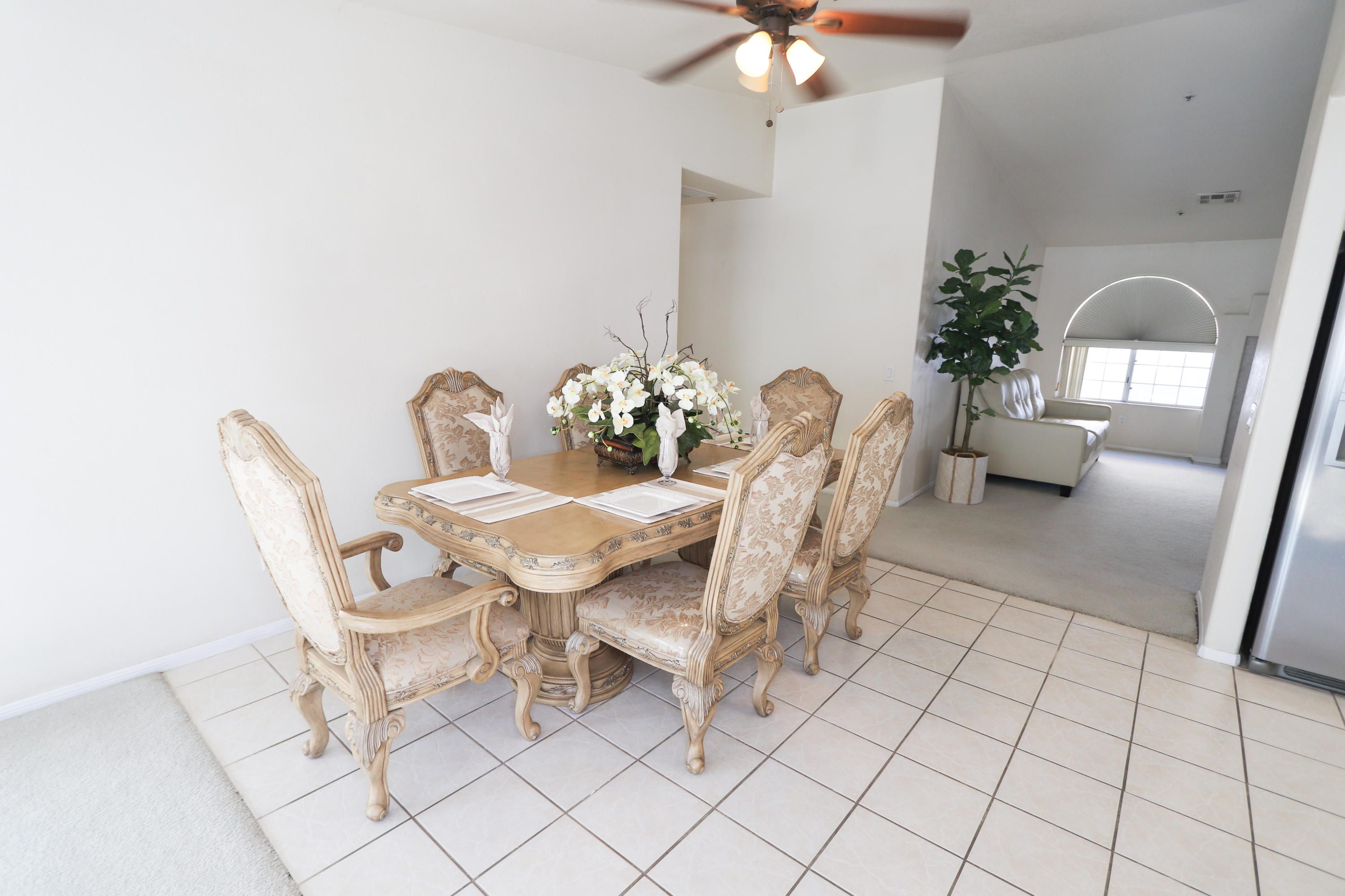 68250 Risueno Road Cathedral City, CA 92234 - Photo 7 of 19 a dining room with furniture and chandelier