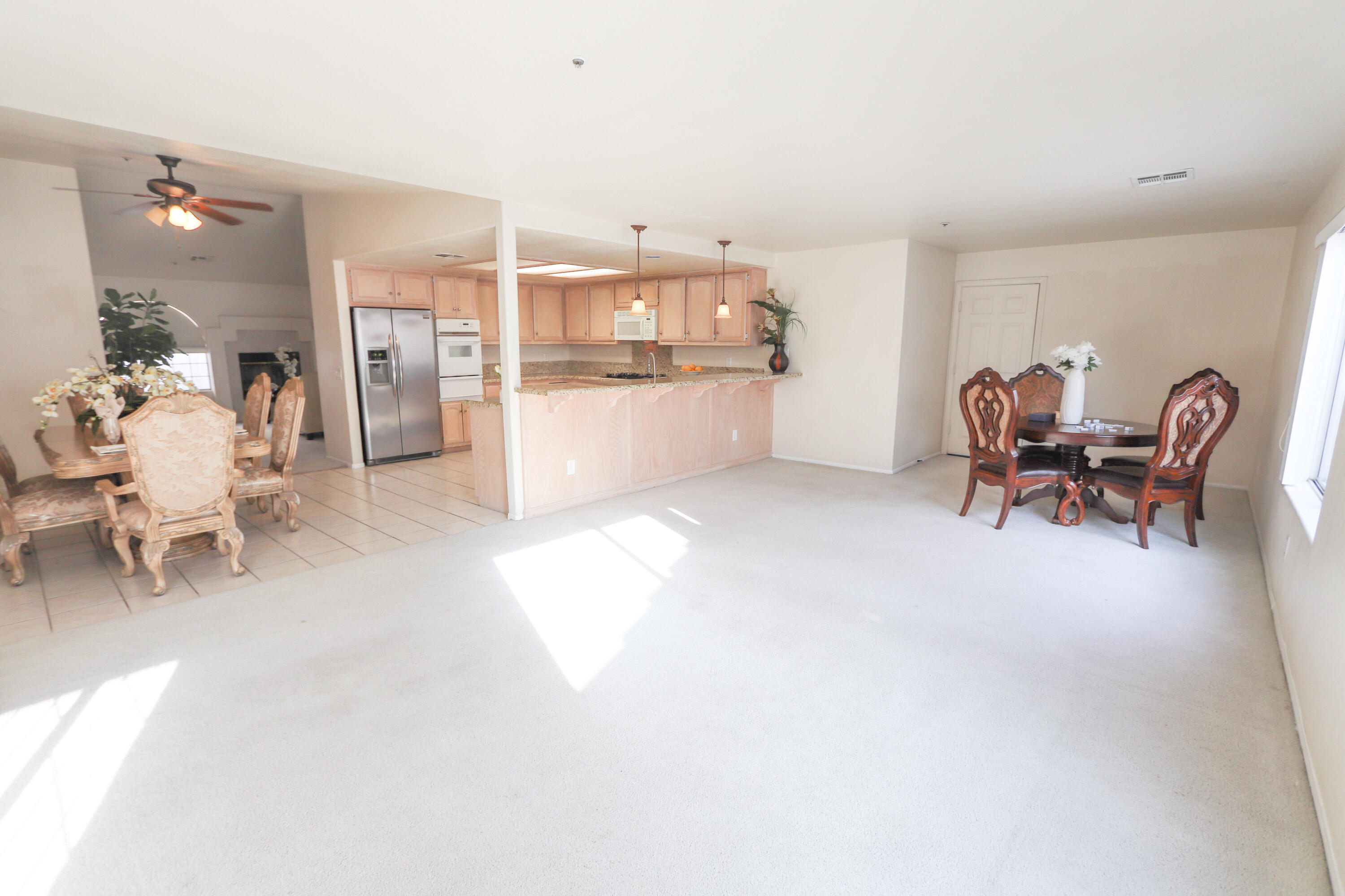 68250 Risueno Road Cathedral City, CA 92234 - Photo 8 of 19 a living room with furniture and kitchen view