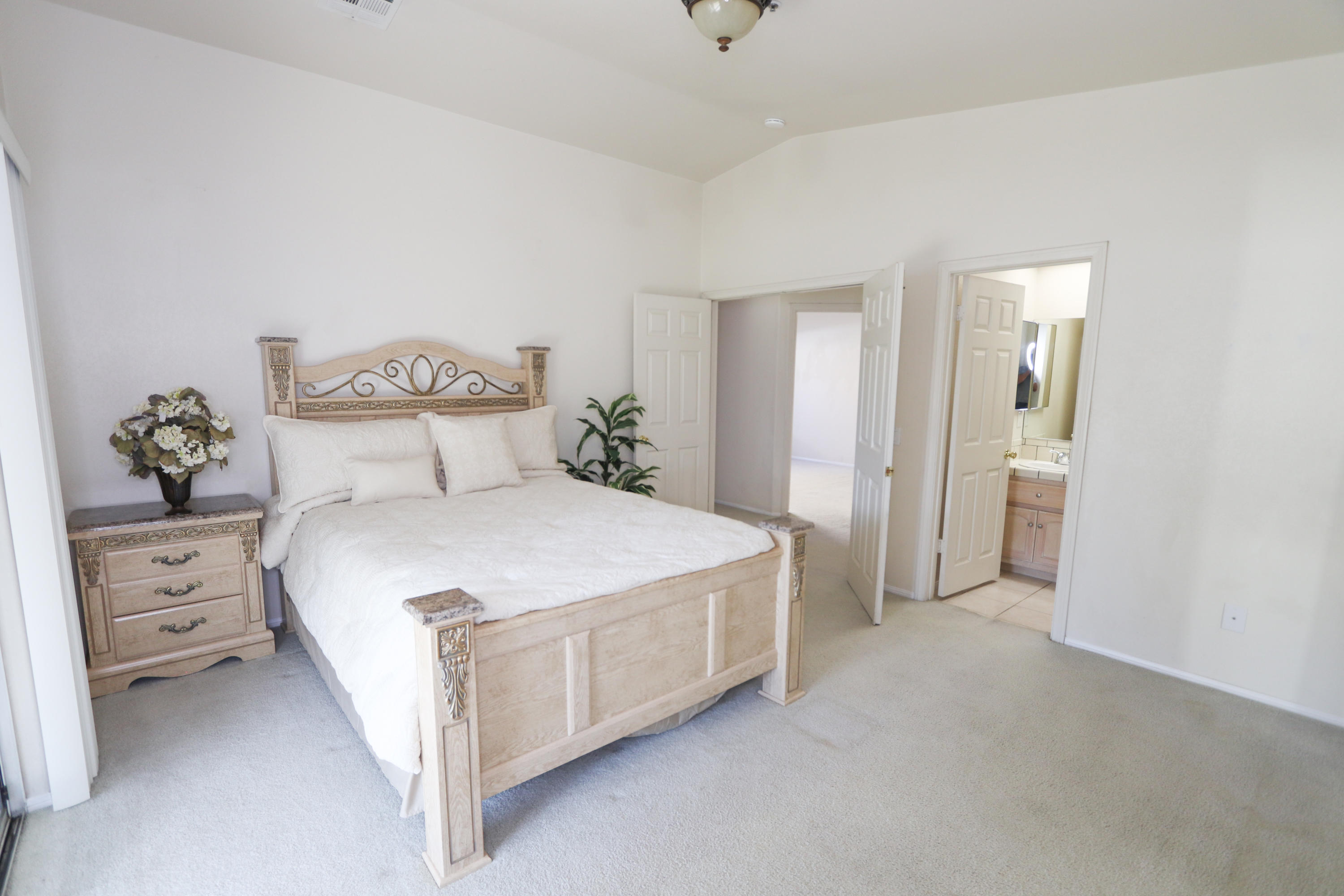 68250 Risueno Road Cathedral City, CA 92234 - Photo 10 of 19 a bedroom with a bed and window