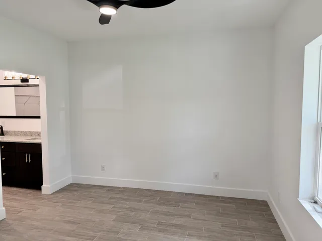a bathroom with a sink vanity and a mirror