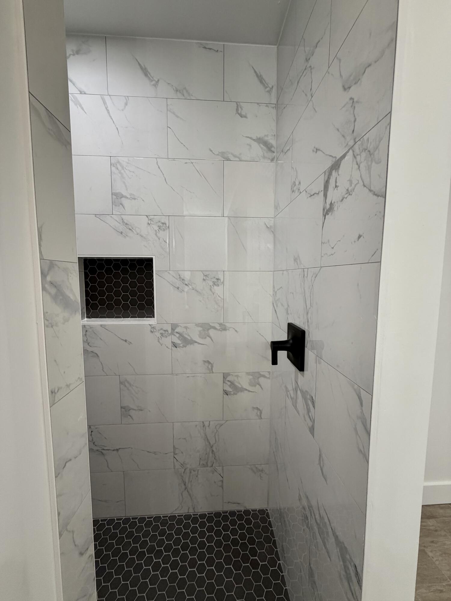 874 West Orange Avenue DeFuniak Springs, FL 32435 - Photo 19 of 32 a bathroom with a shower