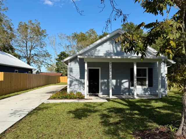 a front view of a house with a garage