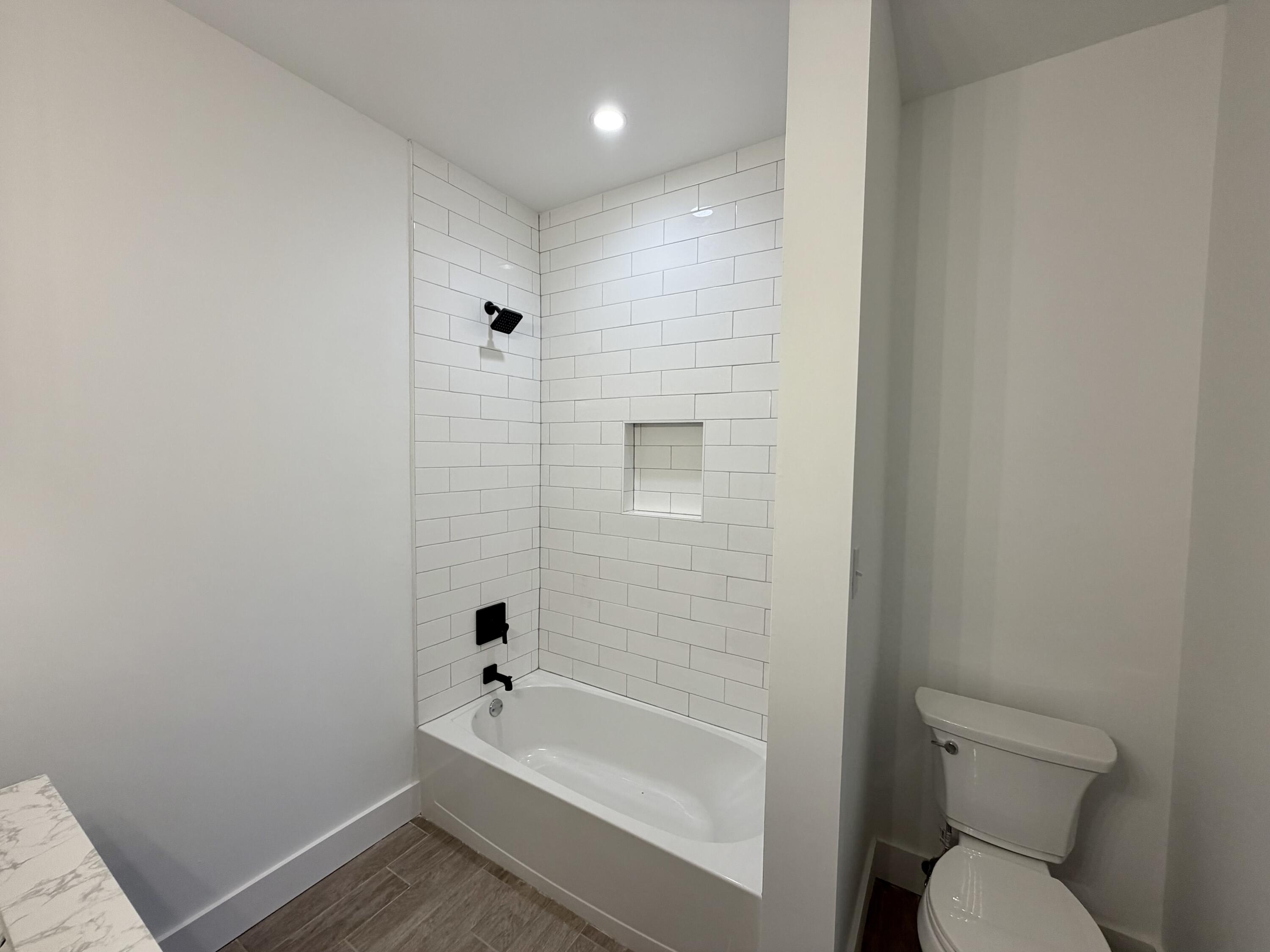 874 West Orange Avenue DeFuniak Springs, FL 32435 - Photo 28 of 32 a bathroom with a bathtub toilet and sink