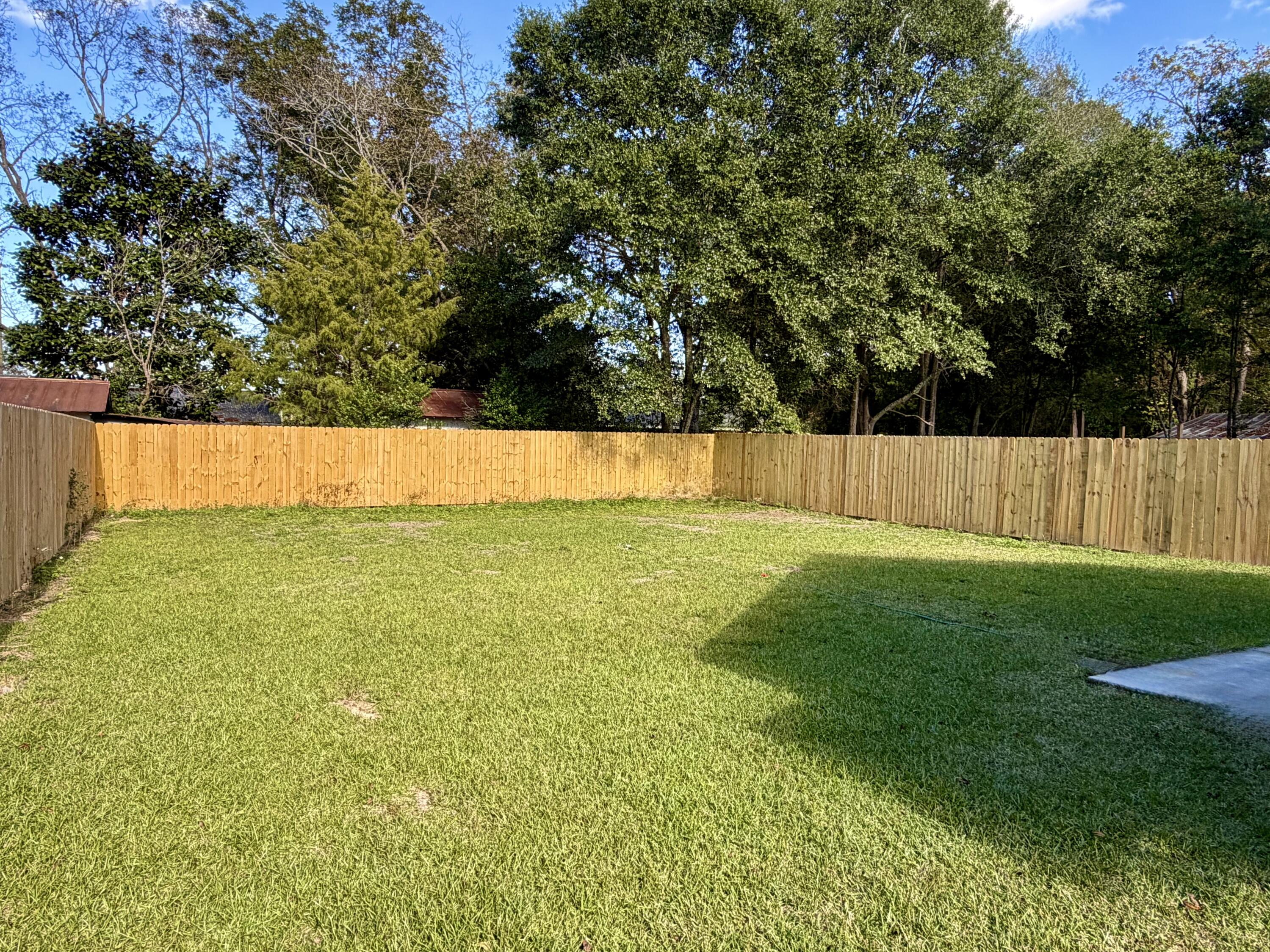 874 West Orange Avenue DeFuniak Springs, FL 32435 - Photo 6 of 32 a view of an outdoor space and a yard