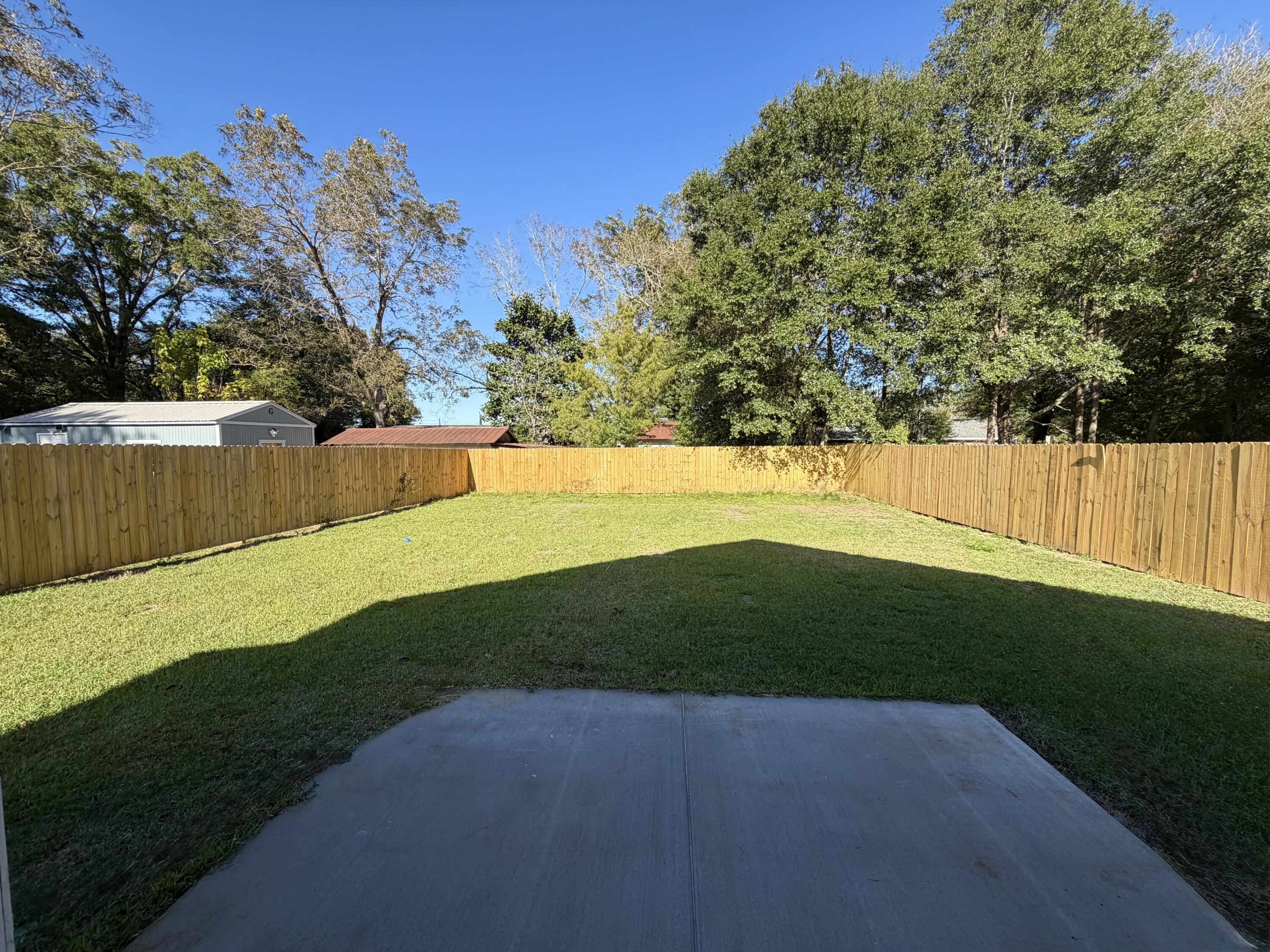 874 West Orange Avenue DeFuniak Springs, FL 32435 - Photo 7 of 32 a view of a yard with a tree