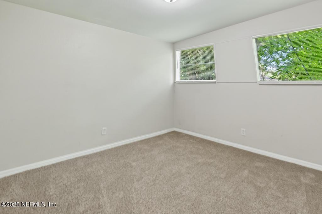 3024 Kline Road Jacksonville, FL 32246 - Photo 12 of 25 an empty room with windows