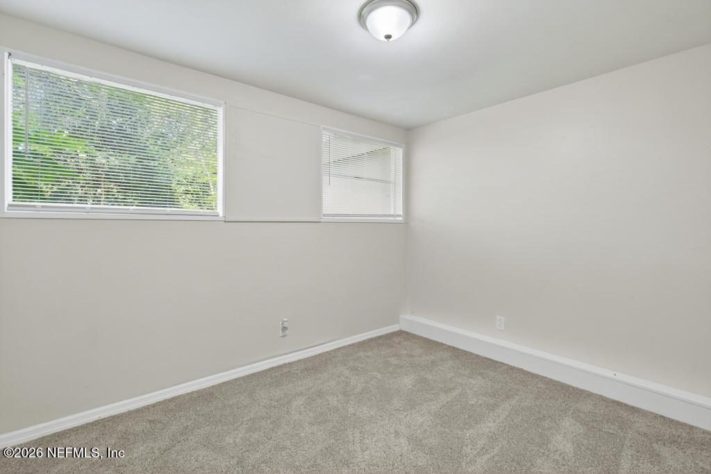3024 Kline Road Jacksonville, FL 32246 - Photo 16 of 25 an empty room with a window
