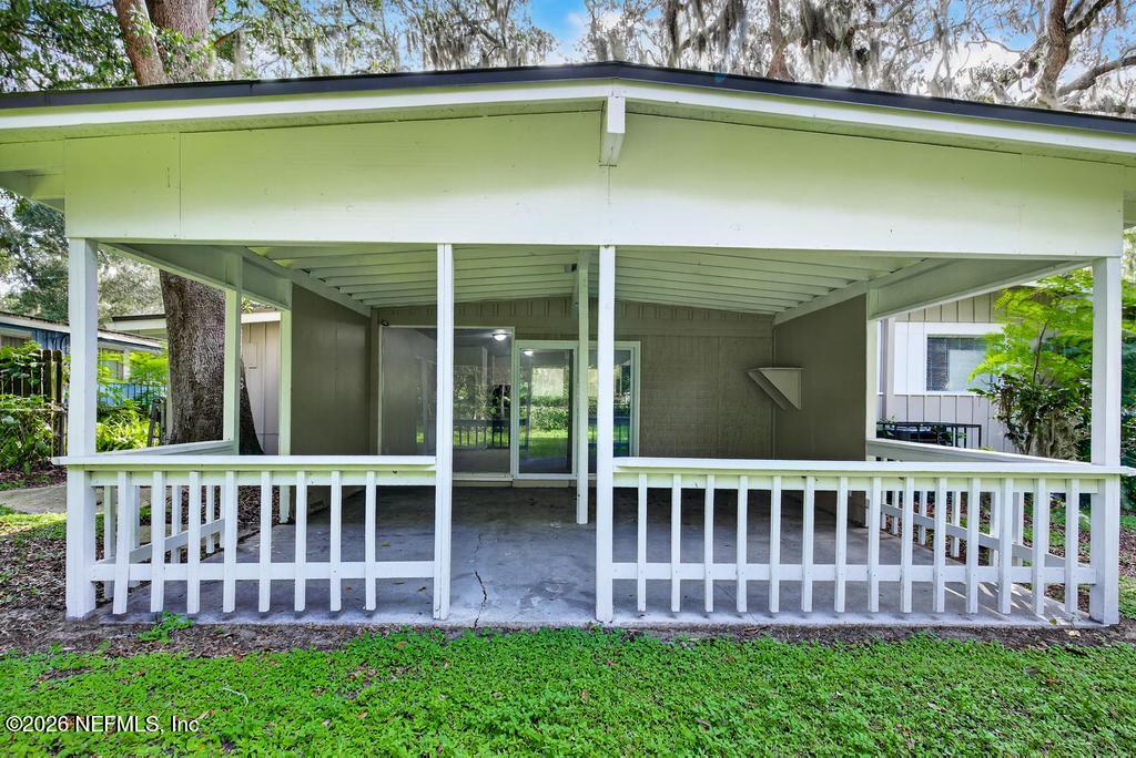 3024 Kline Road Jacksonville, FL 32246 - Photo 22 of 25 a view of a chair and table in the patio
