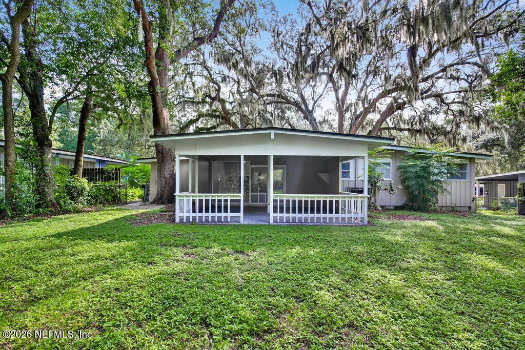 3024 Kline Road Jacksonville, FL 32246 - Photo 23 of 25 a view of a house with a yard and deck