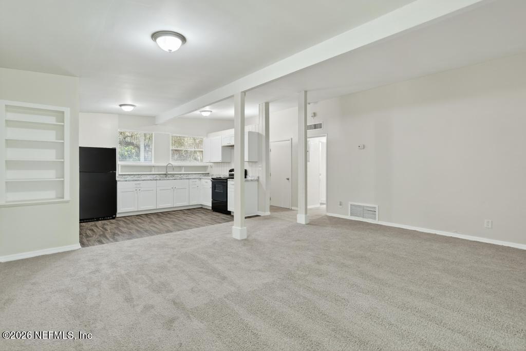3024 Kline Road Jacksonville, FL 32246 - Photo 5 of 25 a view of a kitchen with a refrigerator and a sink
