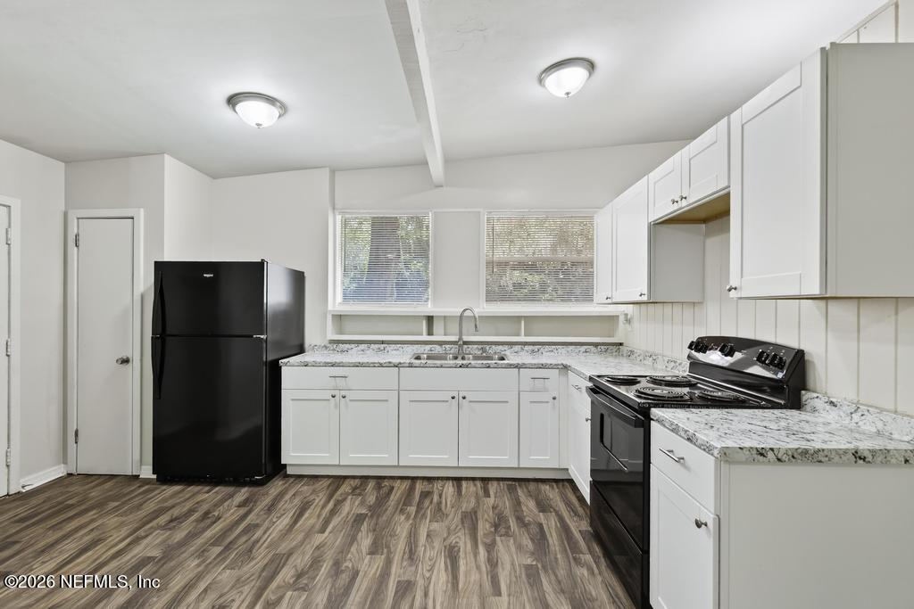 3024 Kline Road Jacksonville, FL 32246 - Photo 7 of 25 a kitchen with a sink stove and refrigerator