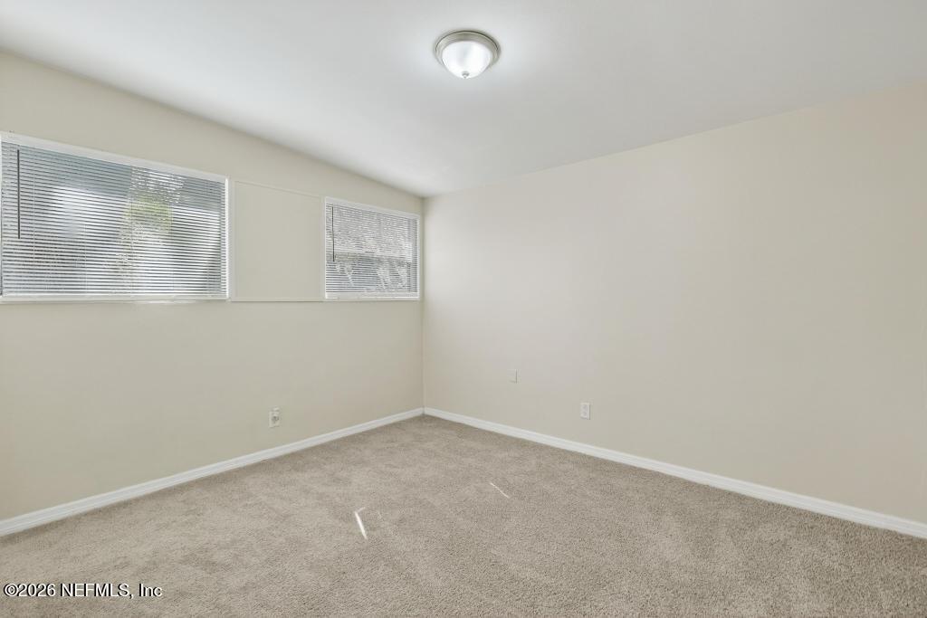 3024 Kline Road Jacksonville, FL 32246 - Photo 8 of 25 an empty room with a window