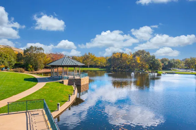 a view of a lake with a house in the background
