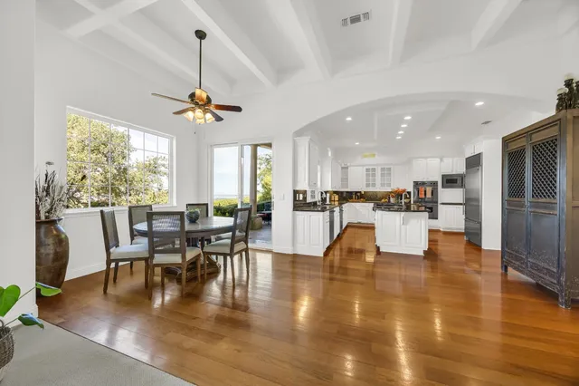 a view of a dining room with furniture window and wooden floor
