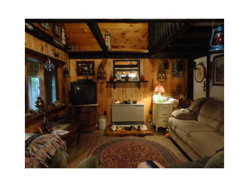 120 Seymour Cove Road Dover-Foxcroft, ME 04426 - Photo 7 of 19 Living Room. Livingroom pine...
