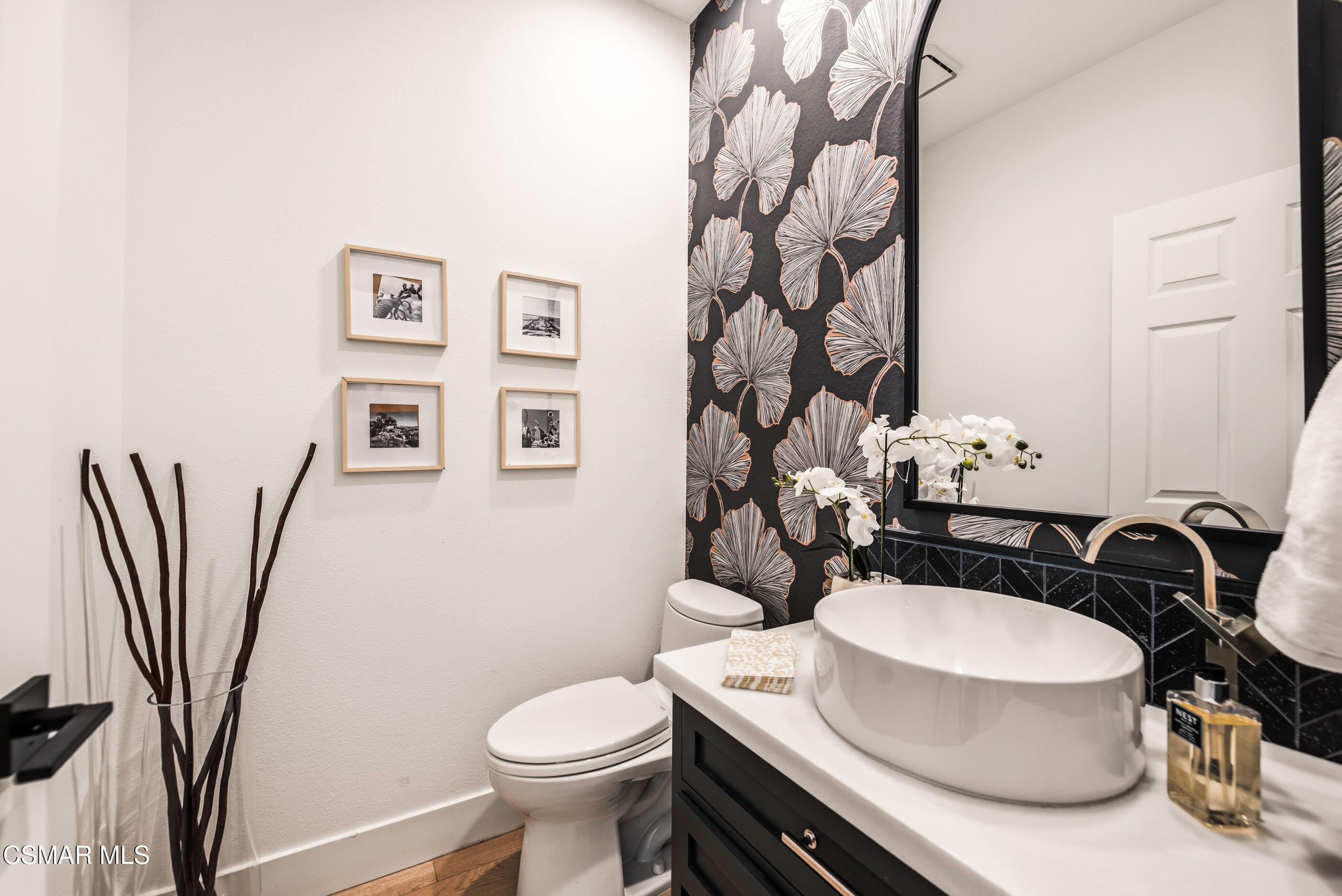 2810 Rikkard Drive Thousand Oaks, CA 91362 - Photo 16 of 38 a bathroom with a sink a toilet and a mirror