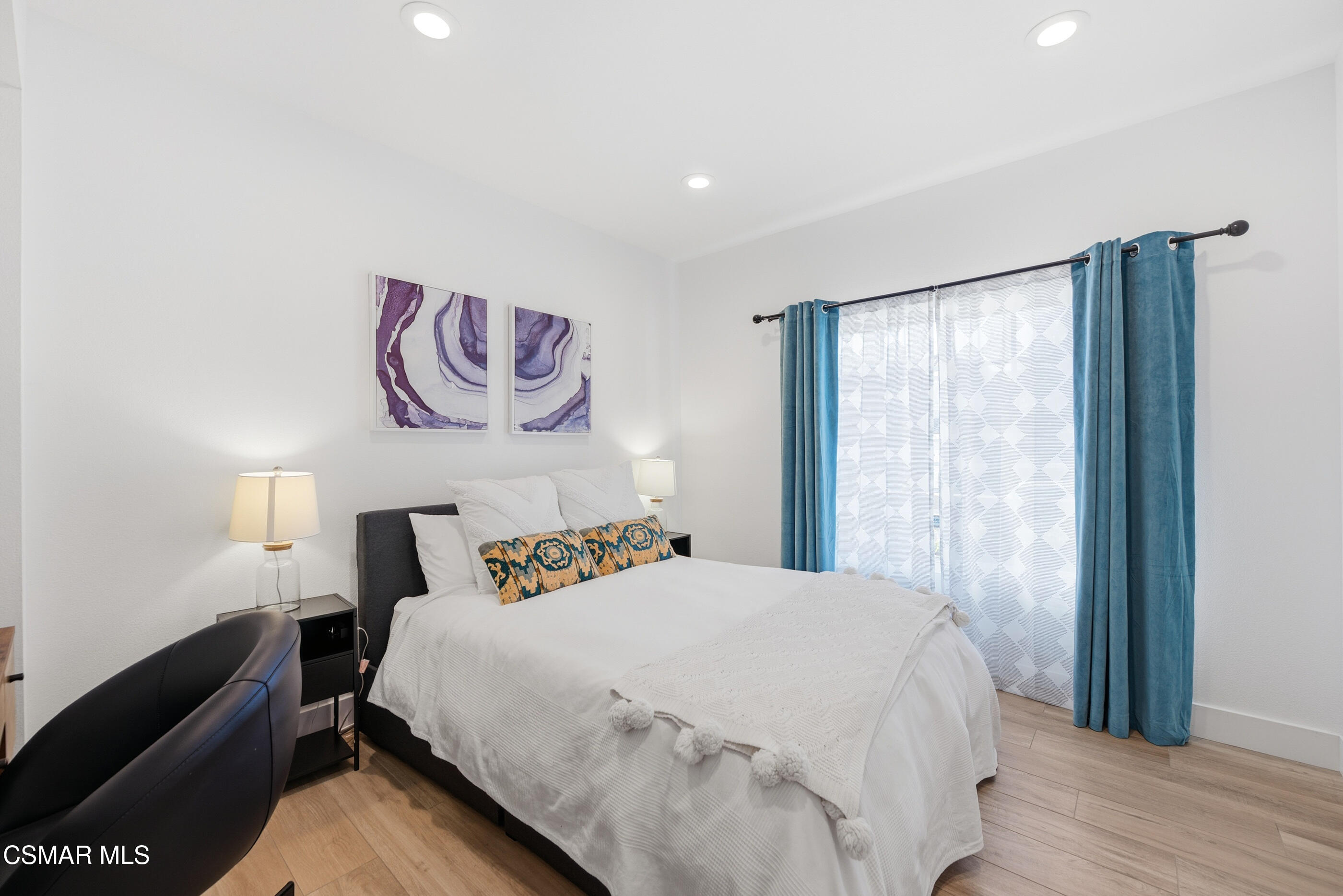 2810 Rikkard Drive Thousand Oaks, CA 91362 - Photo 17 of 38 a bedroom with a bed and wooden floor