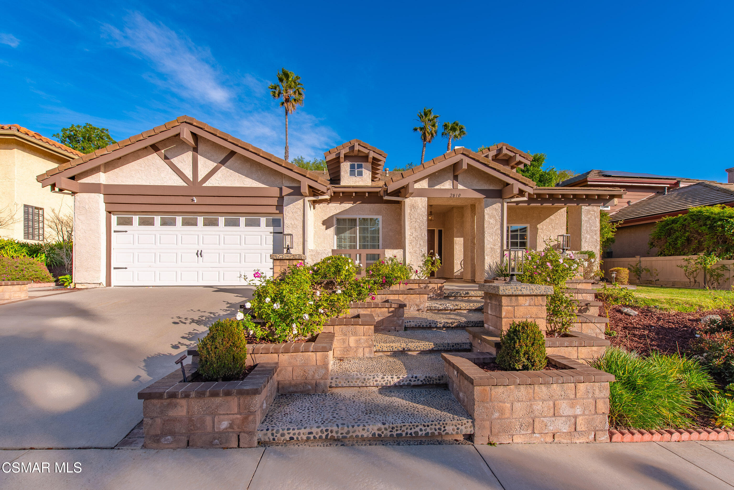 2810 Rikkard Drive Thousand Oaks, CA 91362 - Photo 2 of 38 a front view of a house with a garden