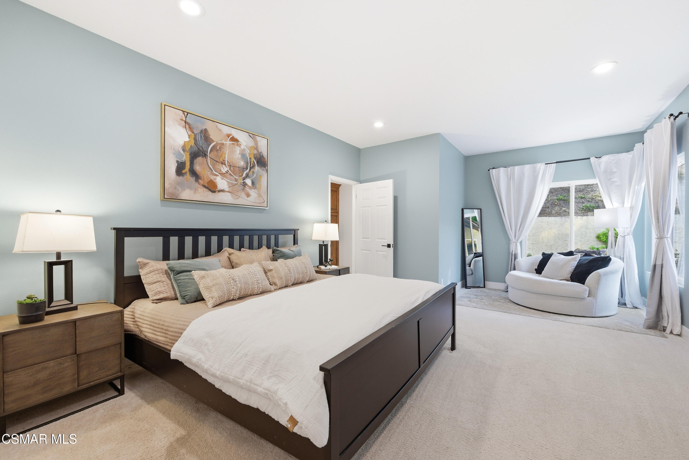 2810 Rikkard Drive Thousand Oaks, CA 91362 - Photo 23 of 38 a spacious bedroom with a large bed and a couch